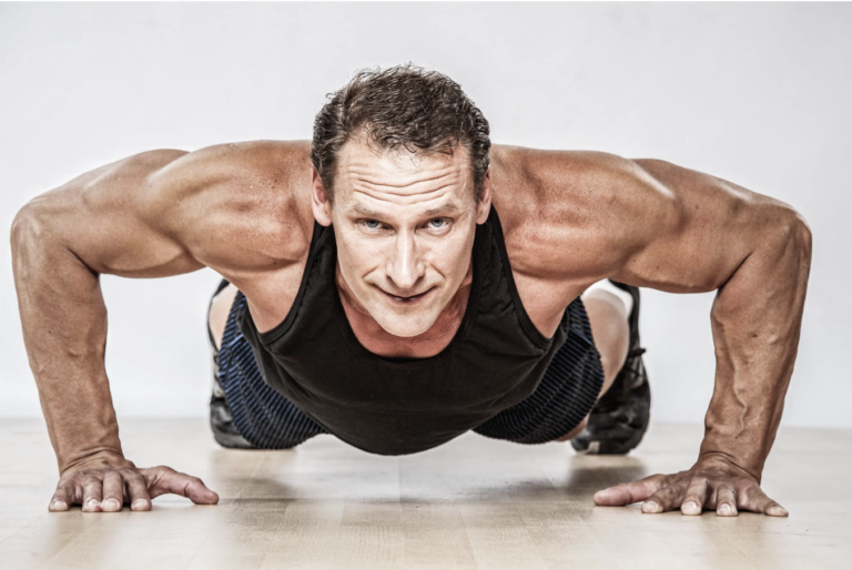 a man over 40 years doing push ups